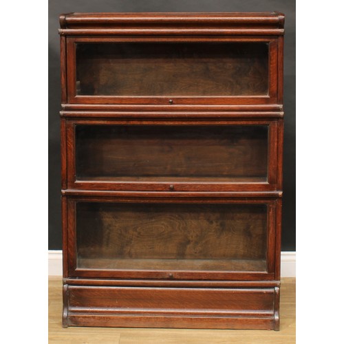 1913 - An early 20th century oak barrister's bookcase, probably Globe Wernicke, comprising three modular st... 