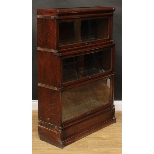 1913 - An early 20th century oak barrister's bookcase, probably Globe Wernicke, comprising three modular st... 