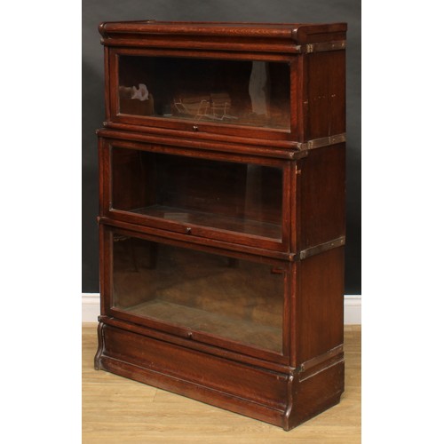 1913 - An early 20th century oak barrister's bookcase, probably Globe Wernicke, comprising three modular st... 