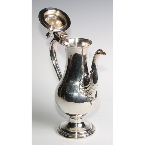 909 - A George III Provincial silver baluster coffee pot, hinged cover with acorn finial, scroll handle, d... 