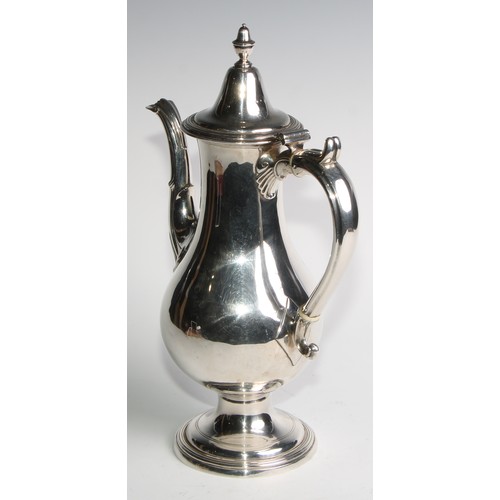 909 - A George III Provincial silver baluster coffee pot, hinged cover with acorn finial, scroll handle, d... 