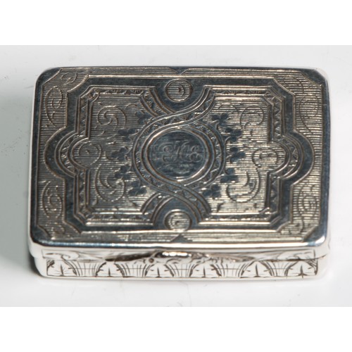 1100 - A Victorian silver rounded rectangular vinaigrette, hinged cover bright-cut engraved with strapwork,... 