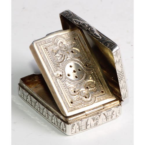 1100 - A Victorian silver rounded rectangular vinaigrette, hinged cover bright-cut engraved with strapwork,... 