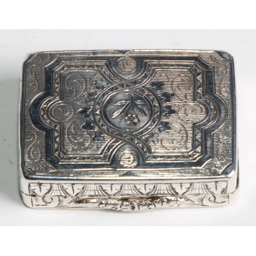 1100 - A Victorian silver rounded rectangular vinaigrette, hinged cover bright-cut engraved with strapwork,... 