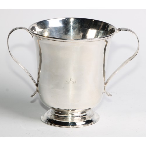 893 - A George II Provincial silver bell shaped loving cup, reeded scroll handles, domed foot, 11.5cm high... 