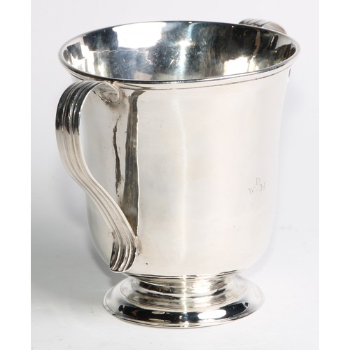 893 - A George II Provincial silver bell shaped loving cup, reeded scroll handles, domed foot, 11.5cm high... 