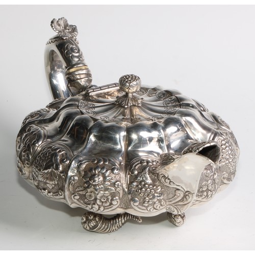 950 - A George IV silver three piece melon shaped tea service, comprising teapot, milk jug and sugar basin... 