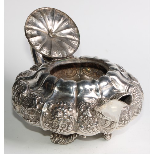 950 - A George IV silver three piece melon shaped tea service, comprising teapot, milk jug and sugar basin... 