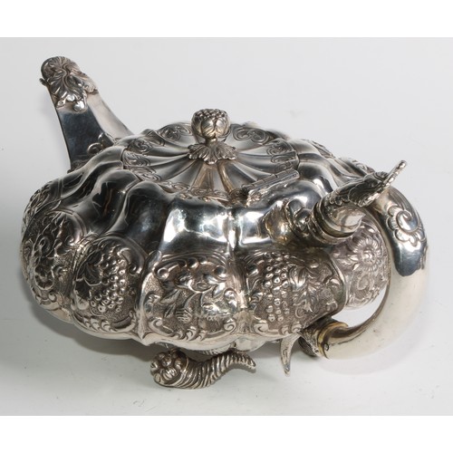 950 - A George IV silver three piece melon shaped tea service, comprising teapot, milk jug and sugar basin... 