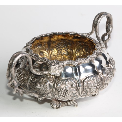 950 - A George IV silver three piece melon shaped tea service, comprising teapot, milk jug and sugar basin... 