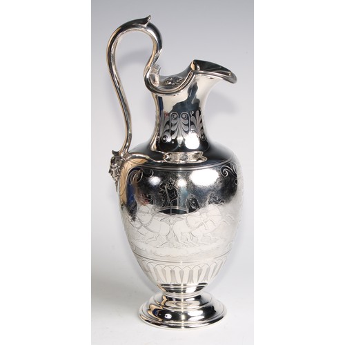 1080 - A Victorian Grecian Revival silver wine ewer or claret jug, engraved after the Antique with chariots... 