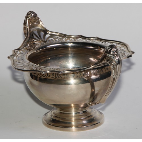 1137 - An Art Nouveau silver two handled pedestal bowl, pierced border, sinuous scroll handles, 19cm wide, ... 