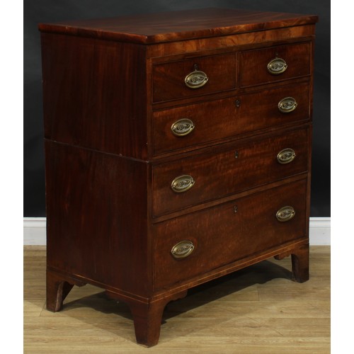 2491 - A George IV mahogany split chest, slightly oversailing top above two short and three long graduated ... 