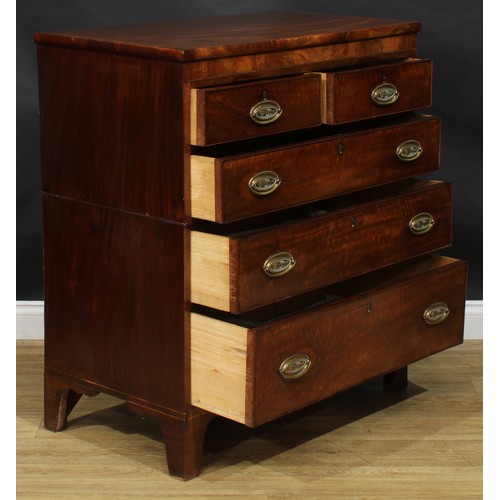 2491 - A George IV mahogany split chest, slightly oversailing top above two short and three long graduated ... 