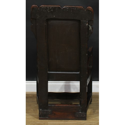 1567 - A 17th century and later oak wainscot chair, shaped rectangular back centred by a panel carved with ... 