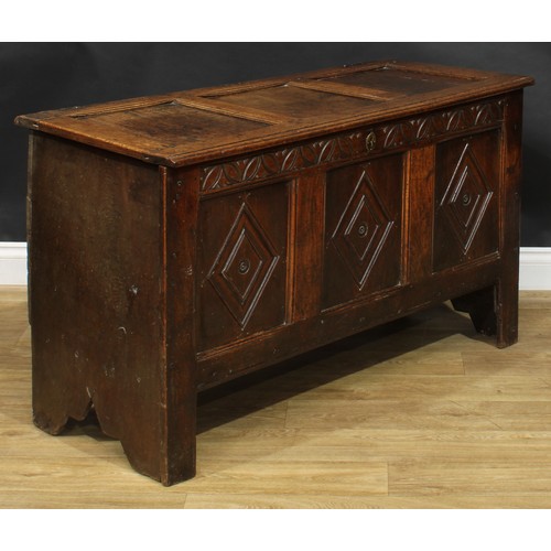 2223 - An early 18th century oak blanket chest, hinged top enclosing an open till above a three panel front... 