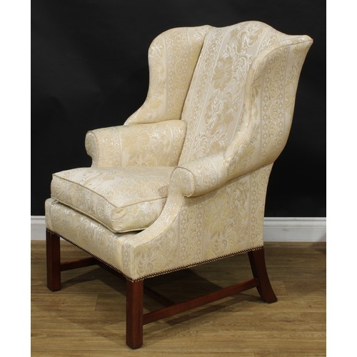 1865 - A pair of contemporary George III style wing chairs, each with stuffed-over upholstery, squab cushio... 