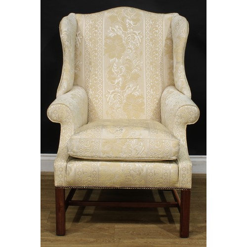 1865 - A pair of contemporary George III style wing chairs, each with stuffed-over upholstery, squab cushio... 