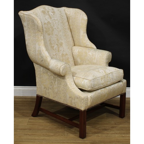 1865 - A pair of contemporary George III style wing chairs, each with stuffed-over upholstery, squab cushio... 