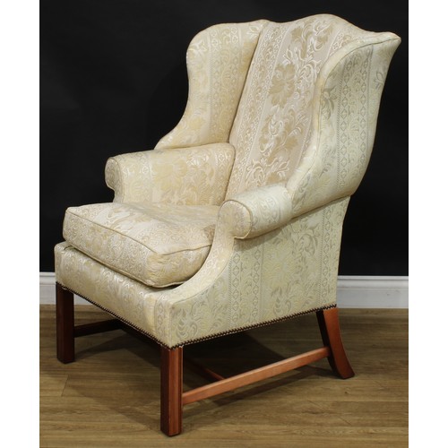 1865 - A pair of contemporary George III style wing chairs, each with stuffed-over upholstery, squab cushio... 