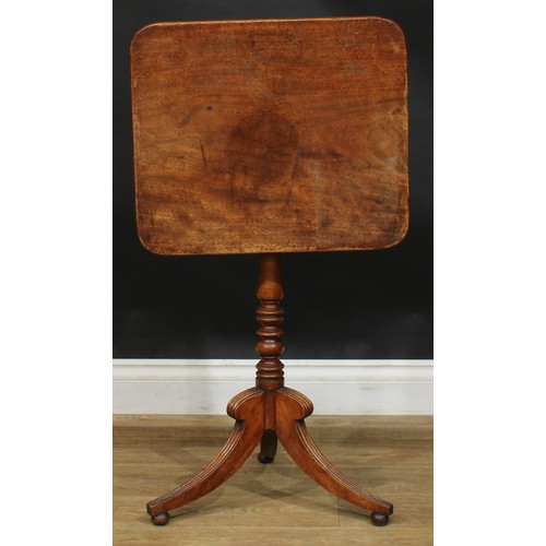 1983 - A Post-Regency mahogany tripod occasional table, rounded rectangular tilting top, turned column, ree... 