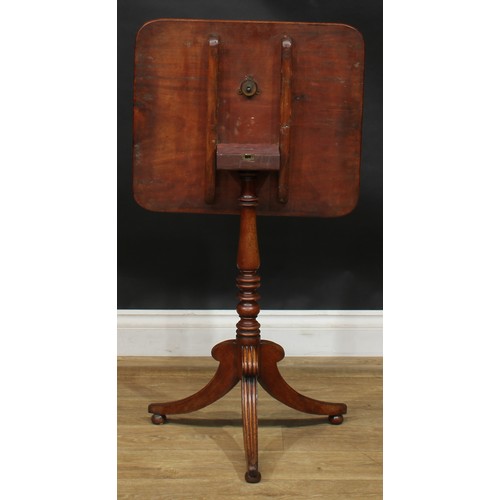 1983 - A Post-Regency mahogany tripod occasional table, rounded rectangular tilting top, turned column, ree... 