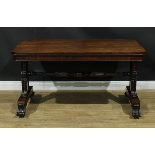 2224 - A William IV rosewood library table, rounded rectangular top, shaped end supports carved and applied... 