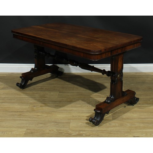 2224 - A William IV rosewood library table, rounded rectangular top, shaped end supports carved and applied... 