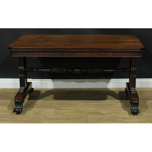 2224 - A William IV rosewood library table, rounded rectangular top, shaped end supports carved and applied... 