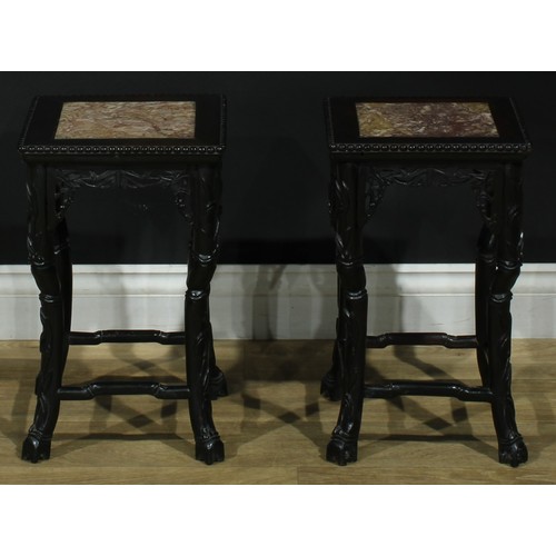 1862 - A pair of Chinese hardwood jardiniere stands, each with a square top with beaded border and inset ma... 