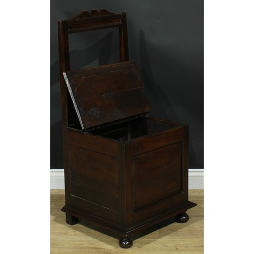 1997 - An 18th century mahogany box chair, rectangular back, hinged seat above a raised and fielded panel, ... 