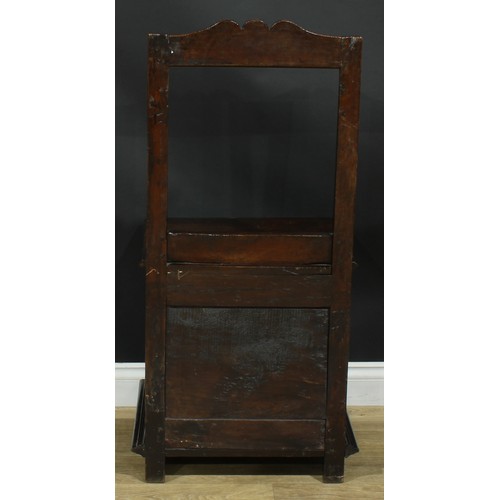 1997 - An 18th century mahogany box chair, rectangular back, hinged seat above a raised and fielded panel, ... 