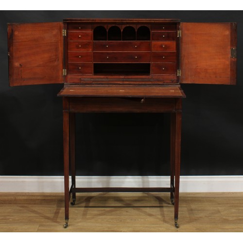 1788 - A George III mahogany campaign cheveret desk or bonheur du jour, rectangular top above a pair of doo... 