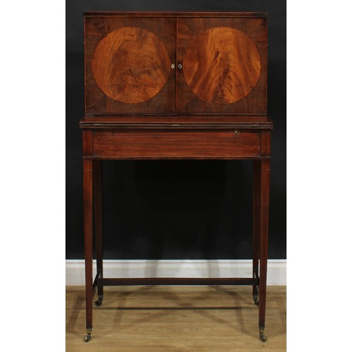 1788 - A George III mahogany campaign cheveret desk or bonheur du jour, rectangular top above a pair of doo... 