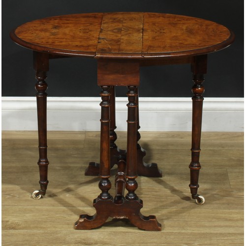 2297 - A Victorian walnut Sutherland table, of small proportions, oval top with fall leaves, turned support... 