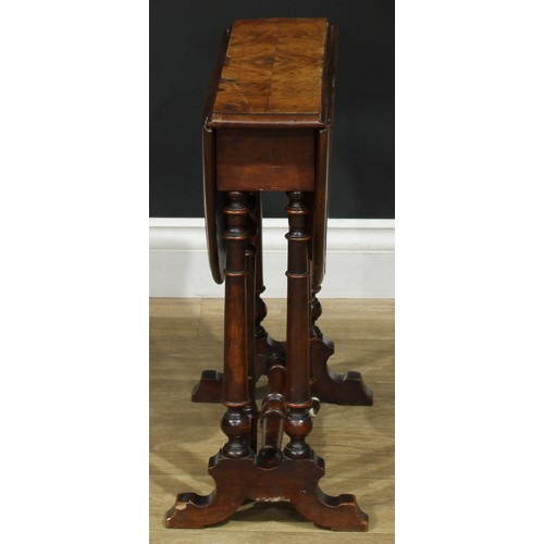 2297 - A Victorian walnut Sutherland table, of small proportions, oval top with fall leaves, turned support... 