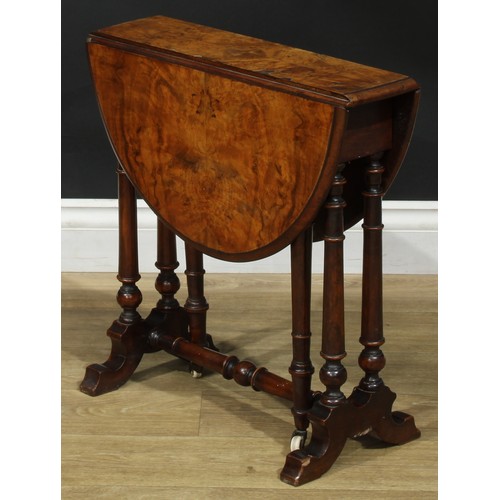 2297 - A Victorian walnut Sutherland table, of small proportions, oval top with fall leaves, turned support... 