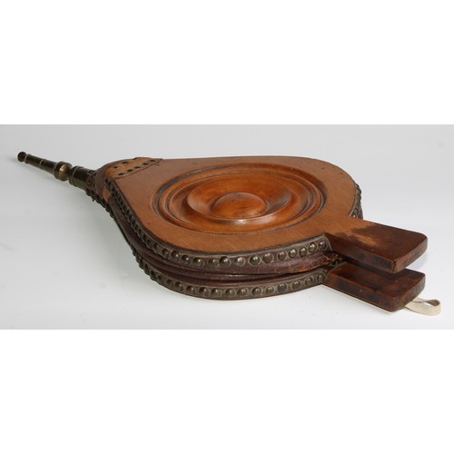 2745 - Treen - a pair of 19th century bellows, centred by a draught-turned roundel, brass spout, 55cm long,... 