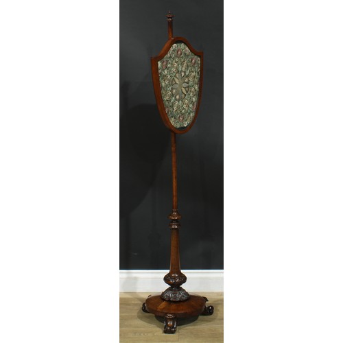 2621 - A William IV rosewood pole screen, pointed knop finial, shield shaped banner embroidered with flower... 