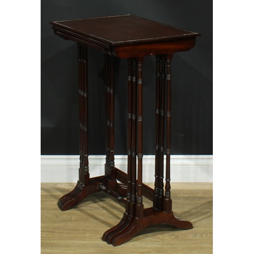 1856 - A nest of three George III Revival mahogany occasional tables, each with a rectangular top, turned s... 