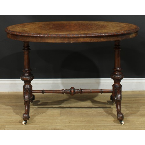 2301 - A Victorian walnut, mahogany and marquetry centre table, rosewood crossbanded oval top with relief c... 