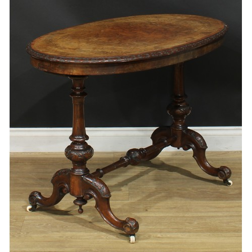 2301 - A Victorian walnut, mahogany and marquetry centre table, rosewood crossbanded oval top with relief c... 