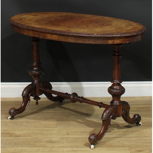 2301 - A Victorian walnut, mahogany and marquetry centre table, rosewood crossbanded oval top with relief c... 