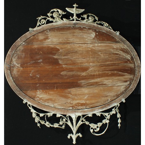 2635 - An Adam Revival painted gesso oval wall mirror, urn finial flanked by swags and leafy scrolls, confo... 