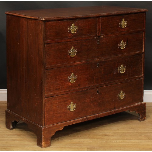 1944 - A George III oak chest, slightly oversailing top above two short and three long graduated cockbeaded... 