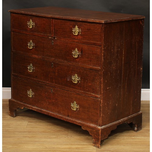 1944 - A George III oak chest, slightly oversailing top above two short and three long graduated cockbeaded... 