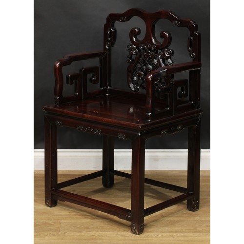 1652 - A Chinese hardwood armchair, the cresting rail, splat and sides carved with a bat, scrolls and trell... 