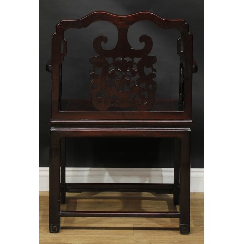 1652 - A Chinese hardwood armchair, the cresting rail, splat and sides carved with a bat, scrolls and trell... 