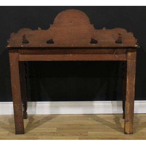 1958 - A late Victorian oak side or serving table, shaped half-gallery centred by a Green Man mask, oversai... 