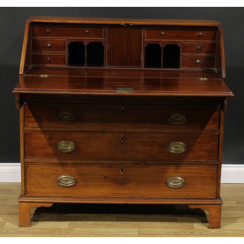 1787 - A George III mahogany bureau, fall front enclosing a fitted interior, above four long graduated cock... 